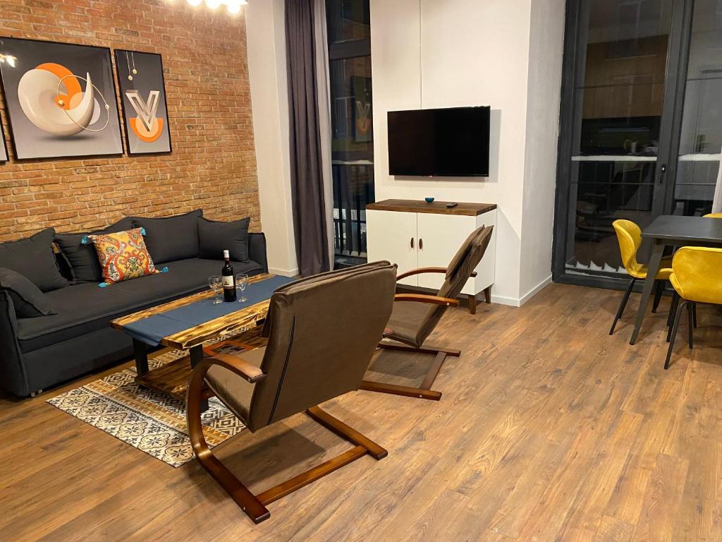TV a/nebo společenská místnost v ubytování Alpic Redco New Gudauri Apartment 305