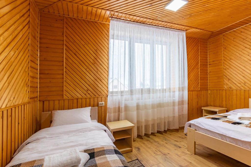 Postel nebo postele na pokoji v ubytování У Румуна