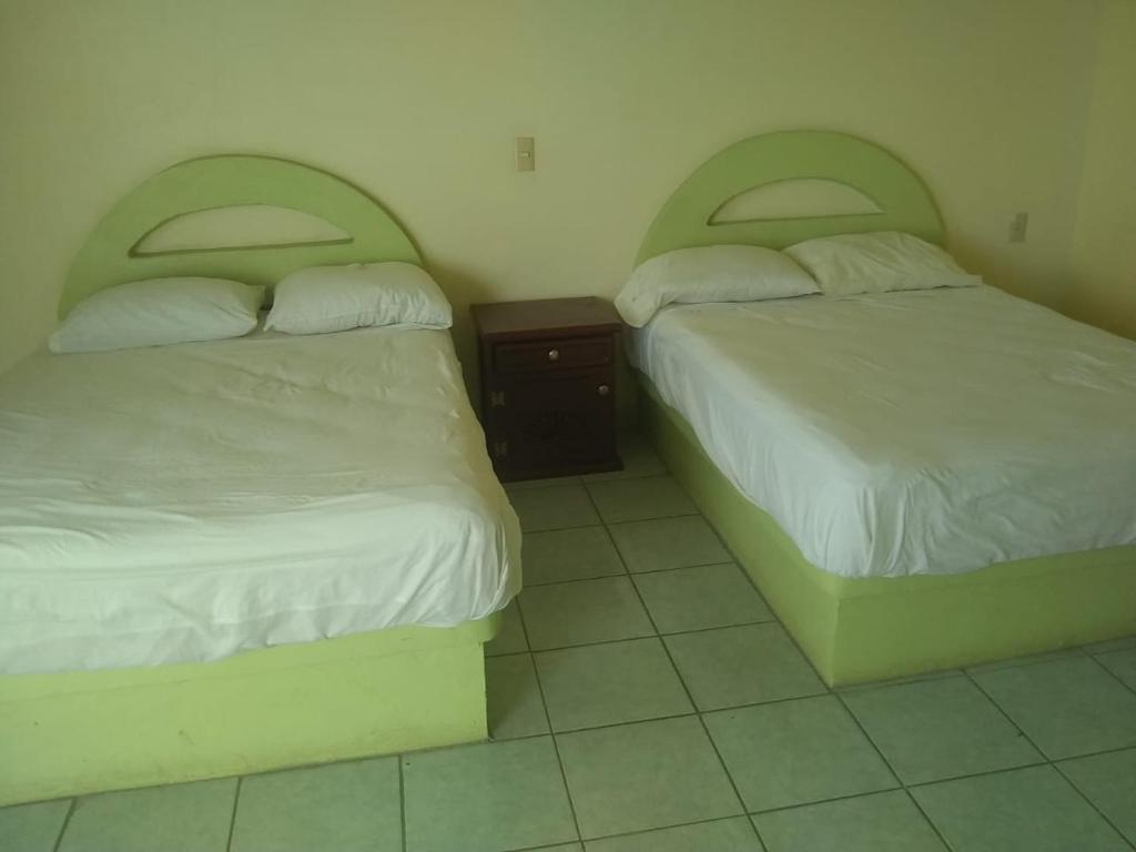 Postel nebo postele na pokoji v ubytování Hotel Azulejos