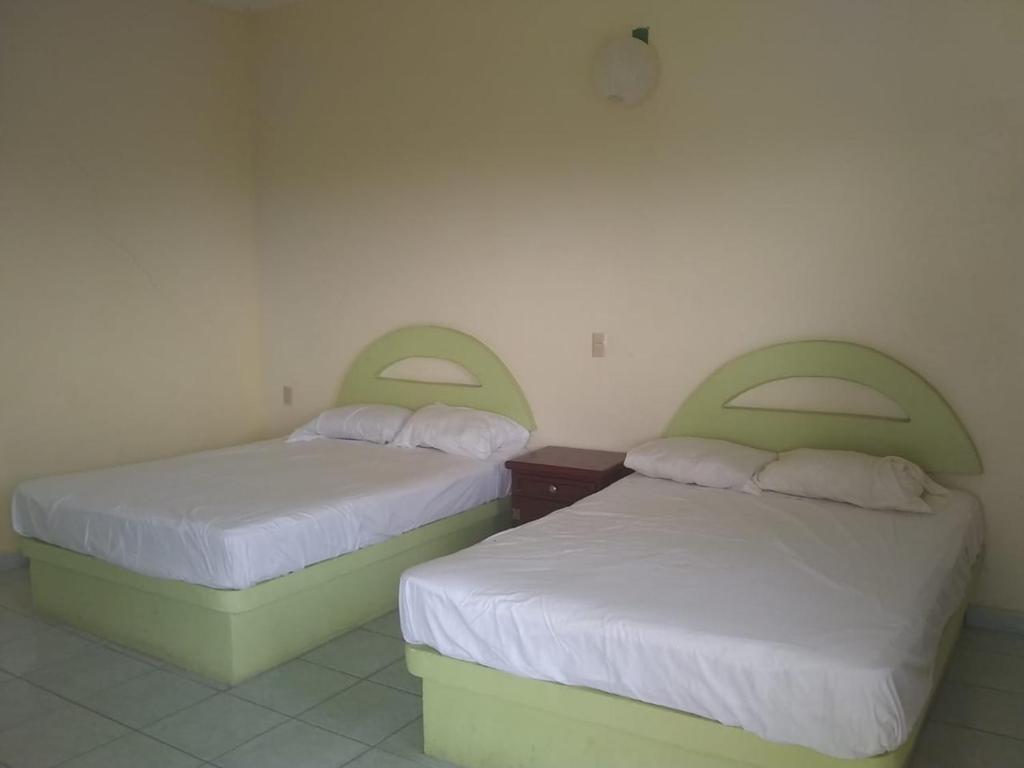 Postel nebo postele na pokoji v ubytování Hotel Azulejos
