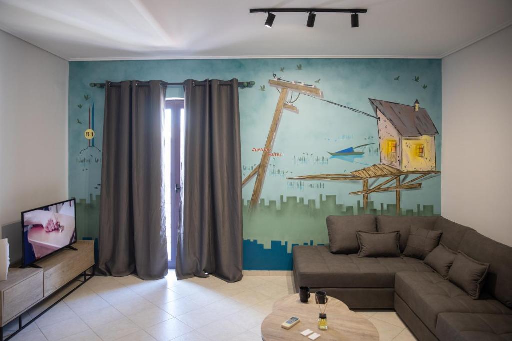 Televízia a/alebo spoločenská miestnosť v ubytovaní Petrino Suites Mesolonghi
