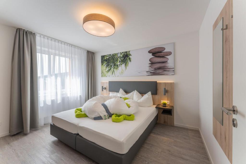 Postel nebo postele na pokoji v ubytování Wohlfühlappartements „Natur & Flair“