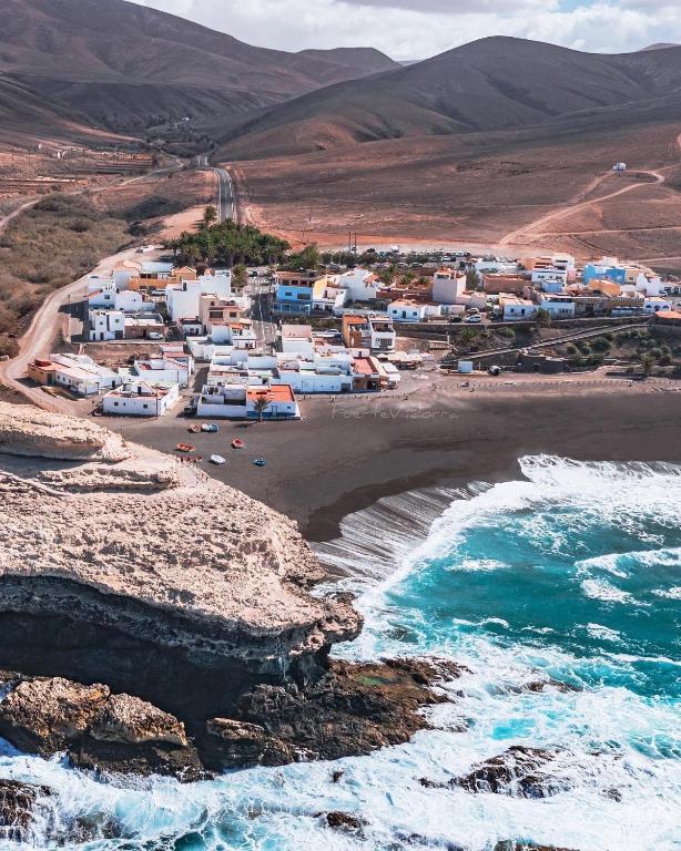 an aerial view of a beach with houses and the ocean at Casa Pano Beach House in Ajuy