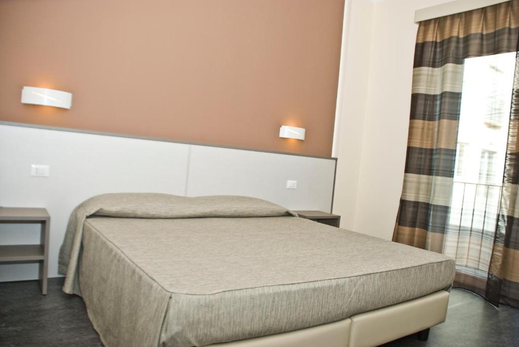 Postel nebo postele na pokoji v ubytování Hotel 4 Strade