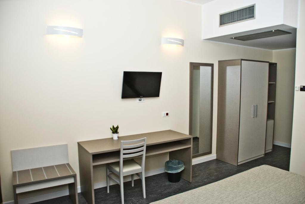 TV a/nebo společenská místnost v ubytování Hotel 4 Strade