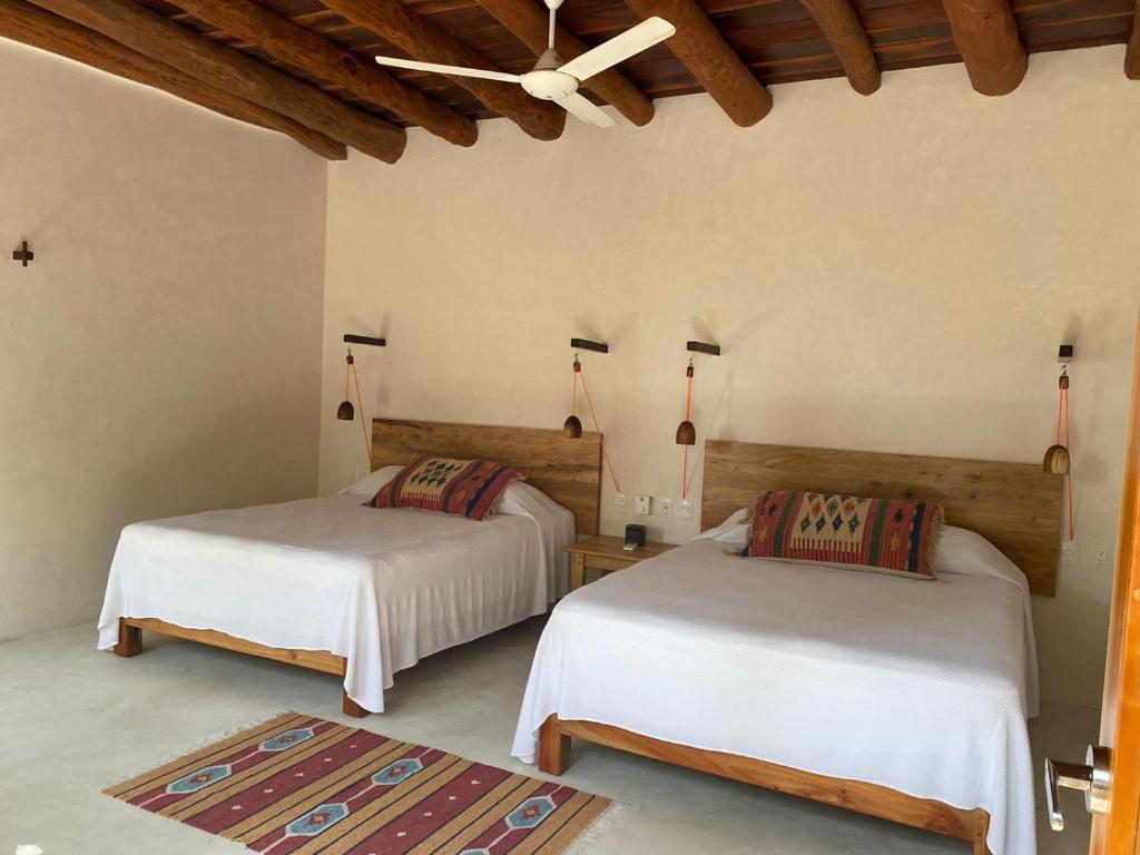 Postel nebo postele na pokoji v ubytování Hotel Poc Na Tulum