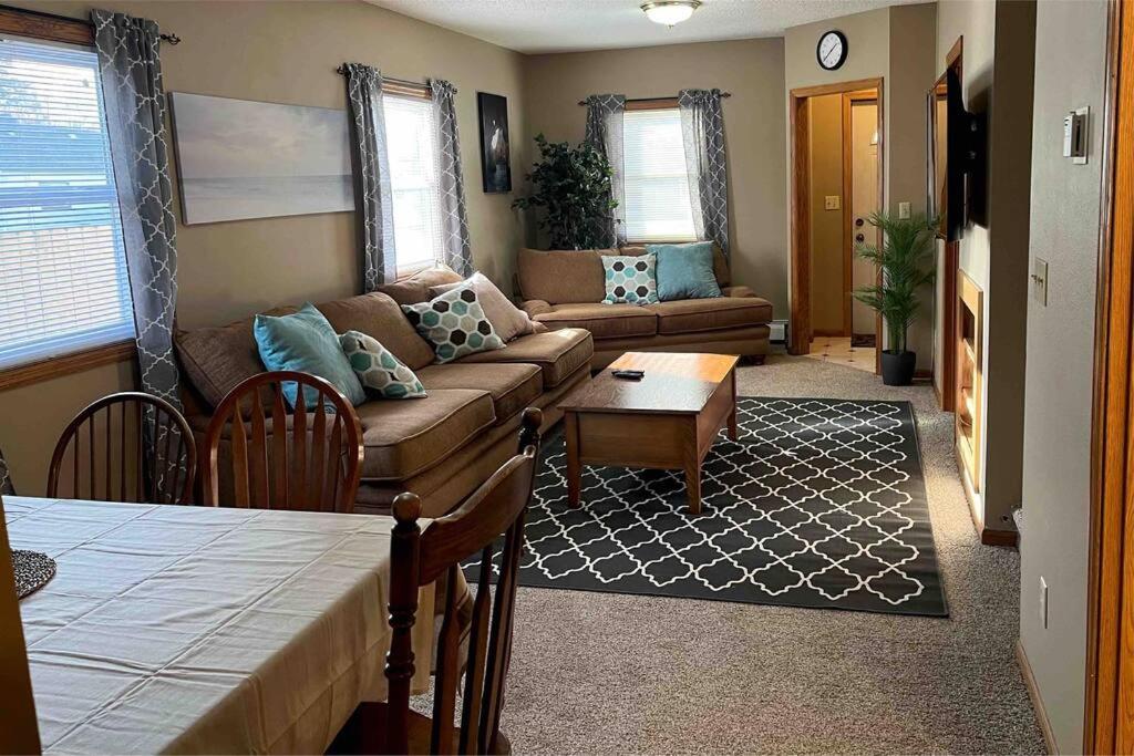 a living room with a couch and a table at Close to Duluth! Centrally Located-Lake Superior Minutes Away! in Superior
