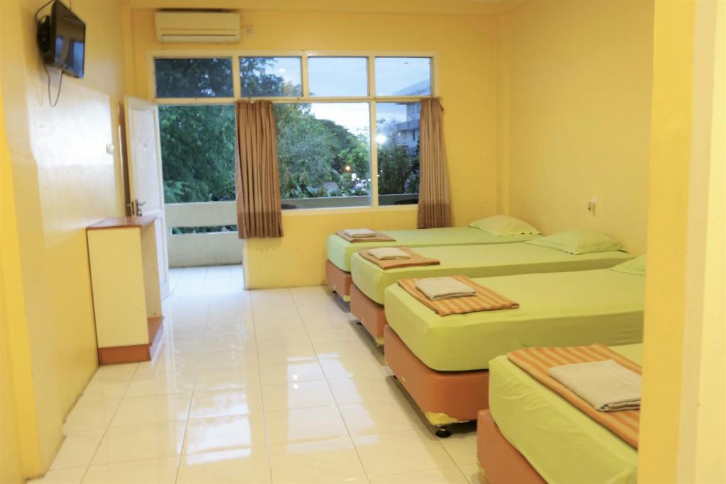 TV a/nebo společenská místnost v ubytování Plum Hotel Lading Banda Aceh