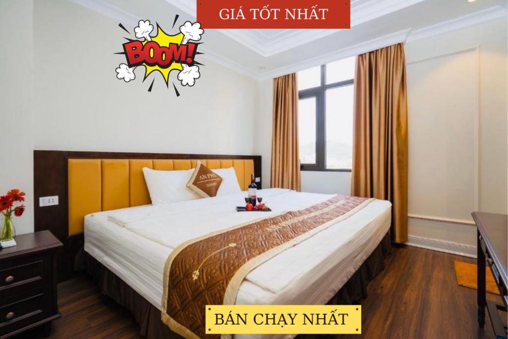a hotel room with a bed with a batman sticker on it at An Phú Nguyễn Hoàng Hotel in Hanoi