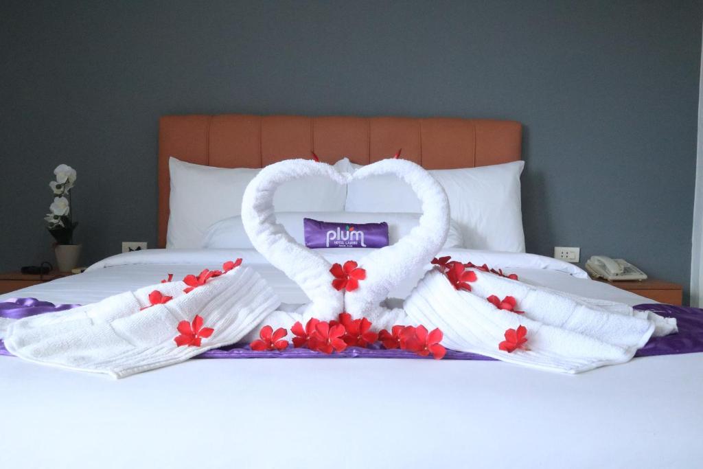 Postel nebo postele na pokoji v ubytování Plum Hotel Lading Banda Aceh