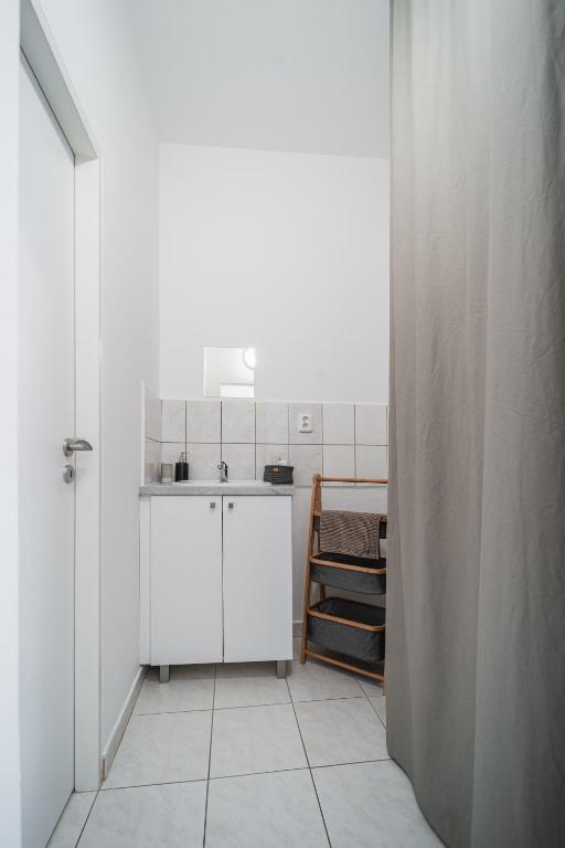Kuchyň nebo kuchyňský kout v ubytování Apartment Yogiam