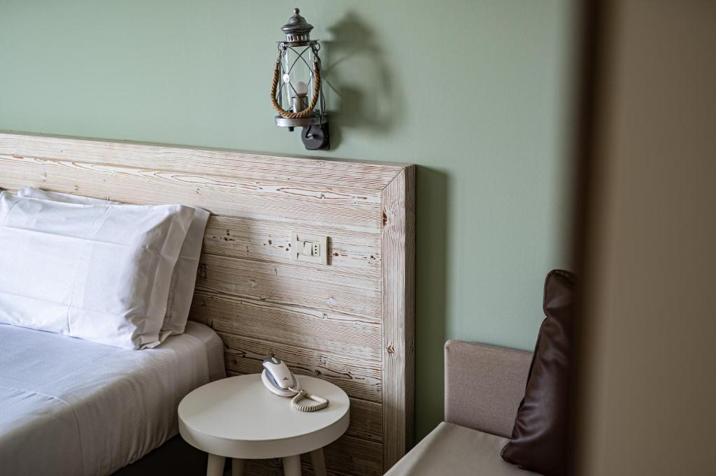 Postel nebo postele na pokoji v ubytování Hotel San Michele