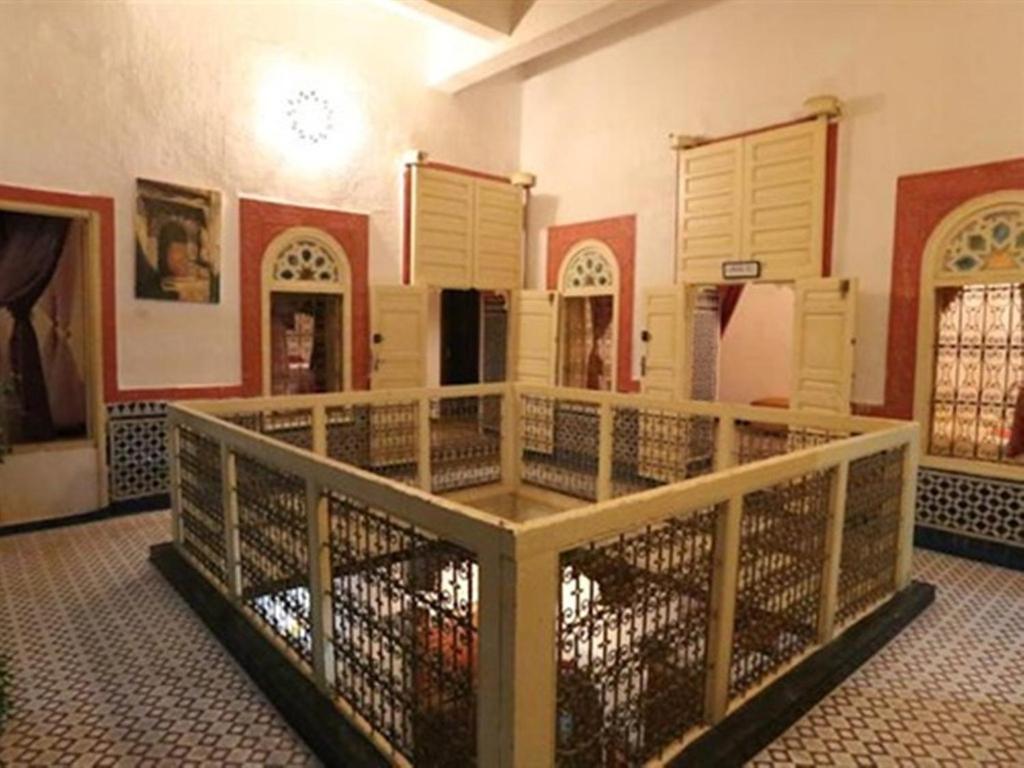 a room with a cage in a building at Riad Azrou in Azrou