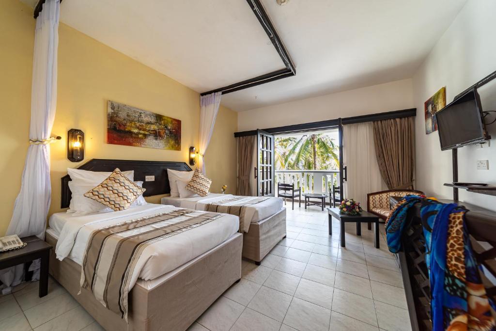 Postel nebo postele na pokoji v ubytování PrideInn Flamingo Beach Resort & Spa Mombasa