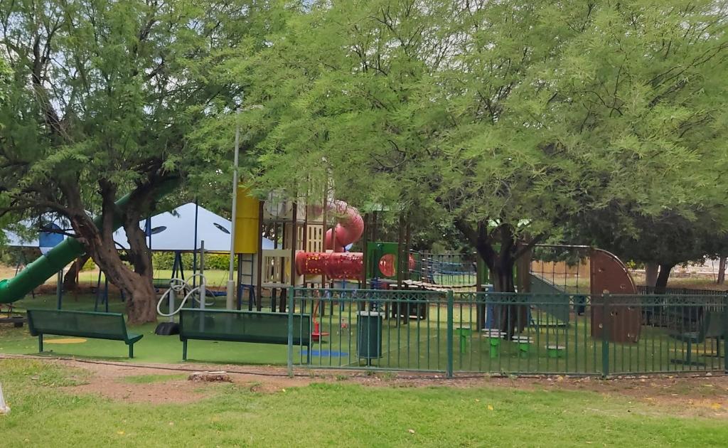 a park with a playground with a slide at אירוח בבקעה in Shadmot Mehola