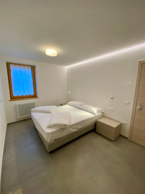 Posteľ alebo postele v izbe v ubytovaní RESIDENZA IL RICCIO