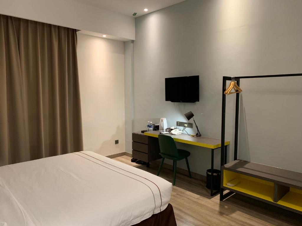Postel nebo postele na pokoji v ubytování K Hotel