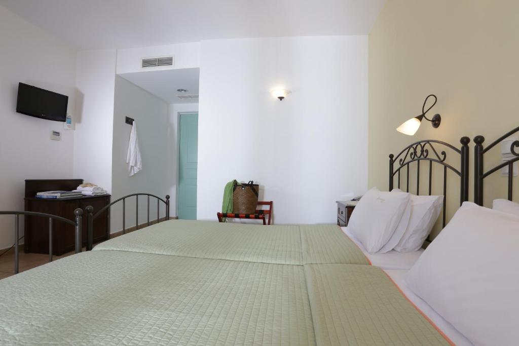 Postel nebo postele na pokoji v ubytování Brazzera Hotel