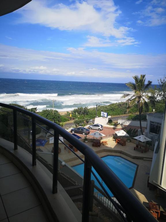 a balcony with a view of the ocean at 208 Coral Reef in La Mercy