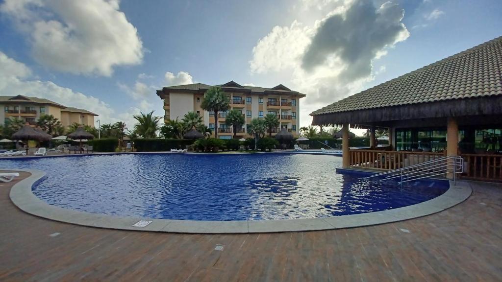 a swimming pool at a resort with condos at Vg Sun Cumbuco in Caucaia