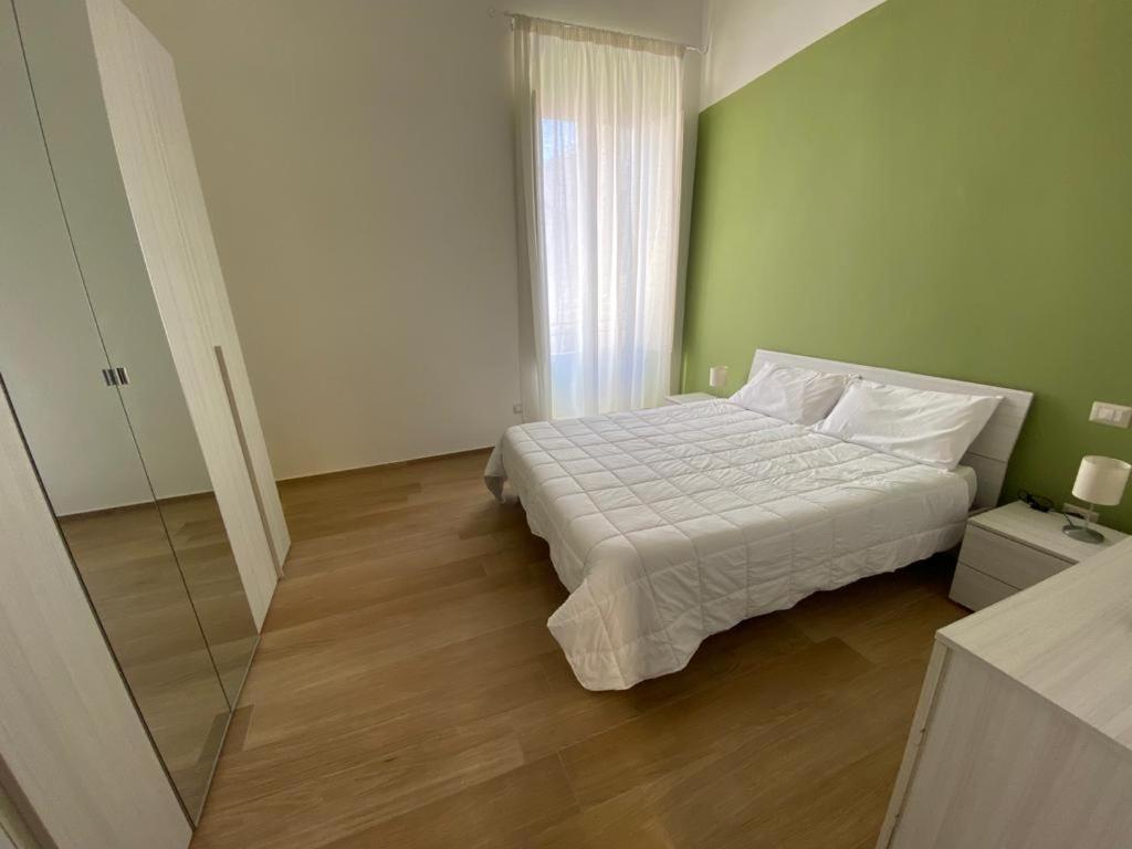 Ένα ή περισσότερα κρεβάτια σε δωμάτιο στο Sant‘Adoeno appartament