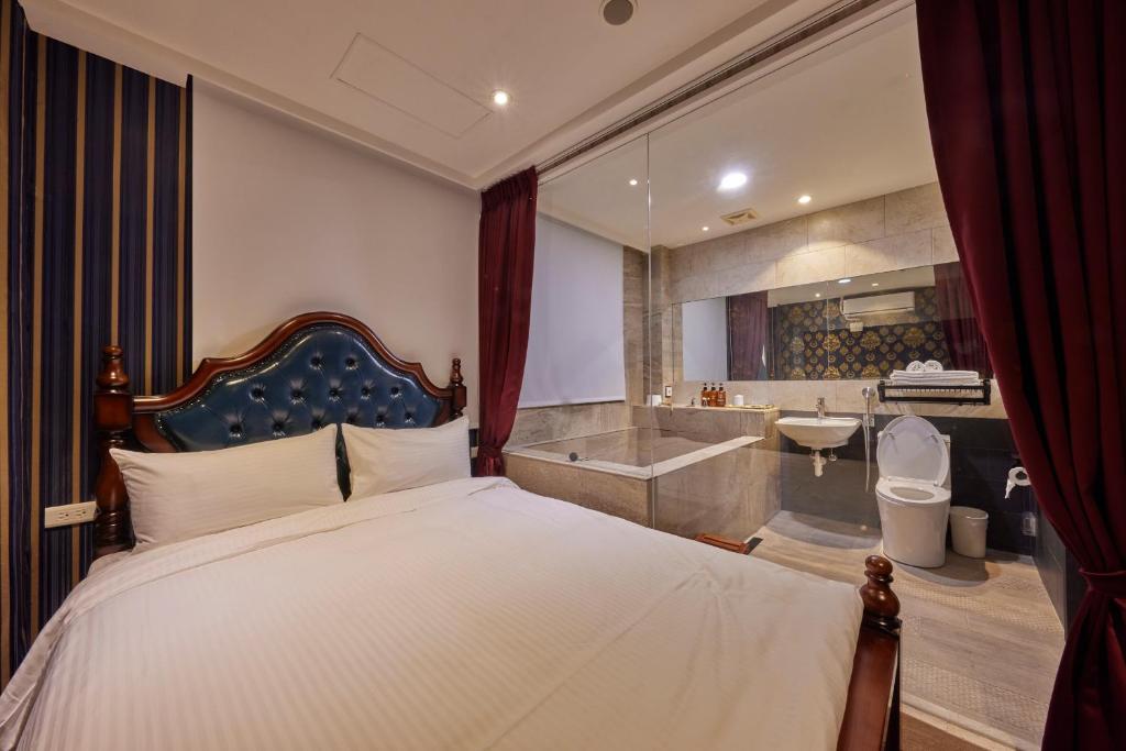 Postel nebo postele na pokoji v ubytování Kyokusui Hotspring Hotel