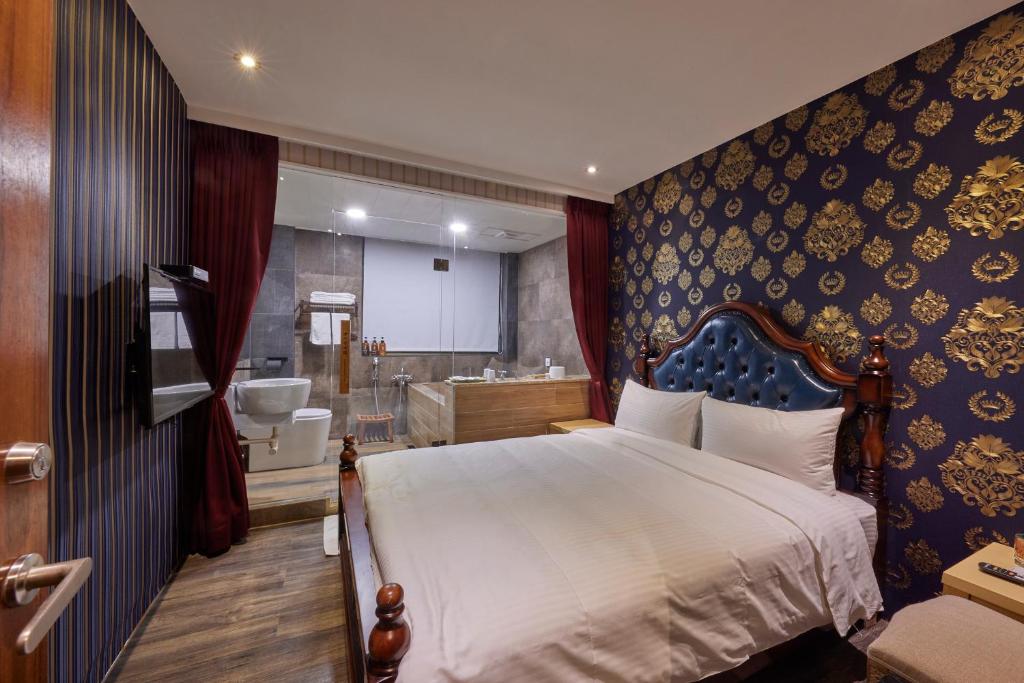 Postel nebo postele na pokoji v ubytování Kyokusui Hotspring Hotel