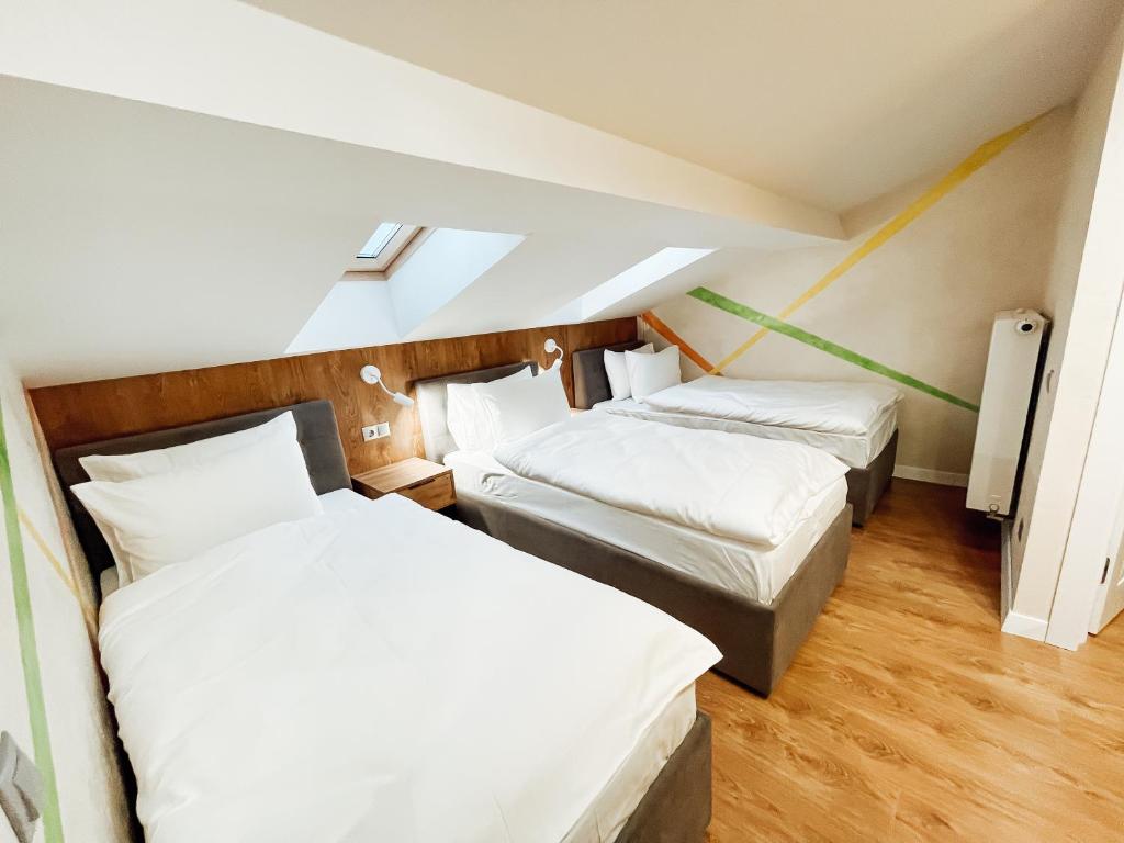 Postel nebo postele na pokoji v ubytování Mountain Residence Apartments & Chalet
