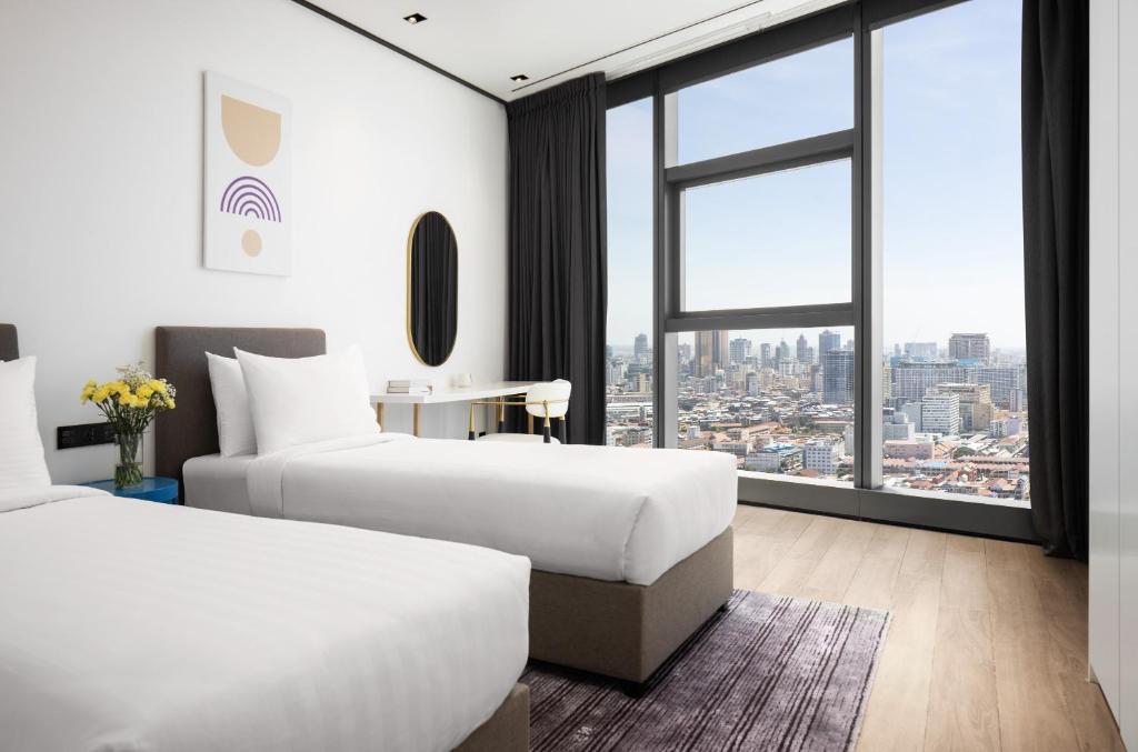 Postel nebo postele na pokoji v ubytování Citadines Flatiron Phnom Penh