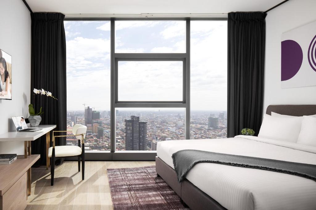 Postel nebo postele na pokoji v ubytování Citadines Flatiron Phnom Penh