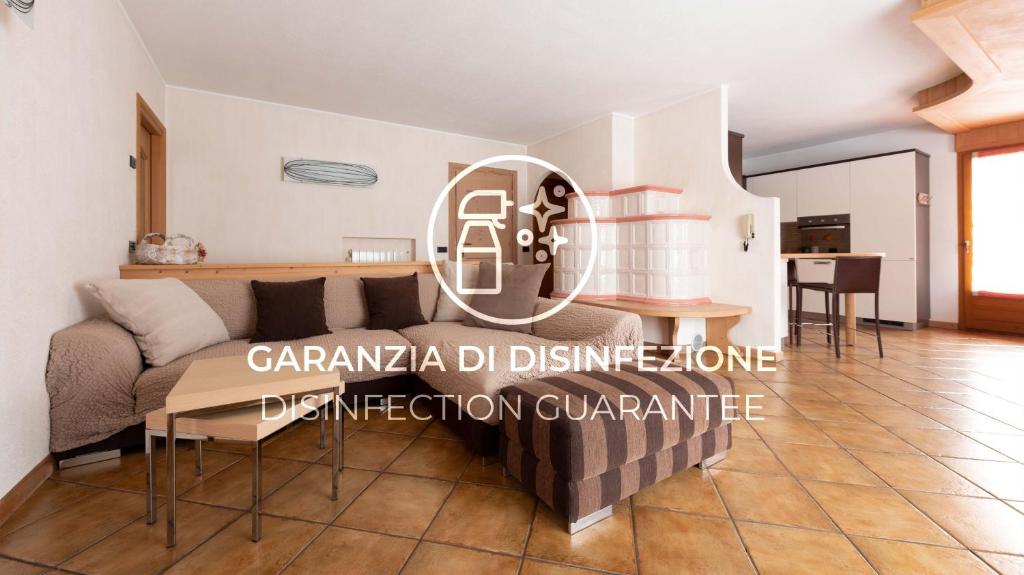 a living room with a couch and a table at Italianway - Funivie 6A in Bormio