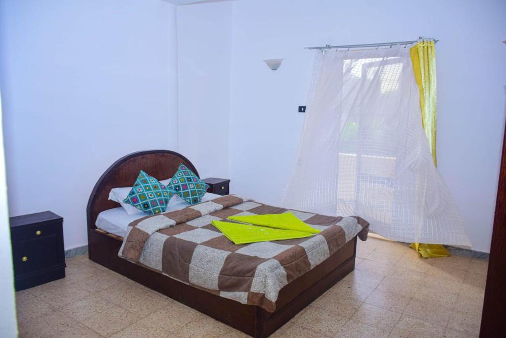 Postel nebo postele na pokoji v ubytování Rose Guest House