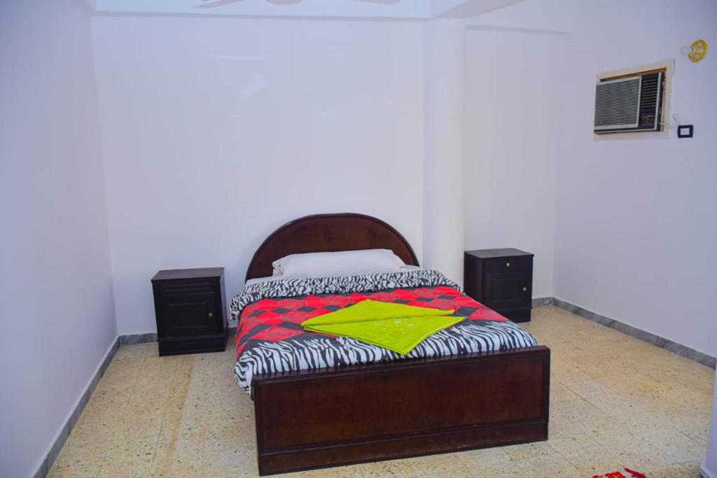 Postel nebo postele na pokoji v ubytování Rose Guest House