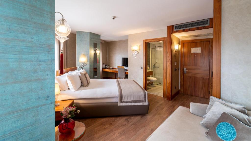 Postel nebo postele na pokoji v ubytování Biz Cevahir Hotel Sultanahmet