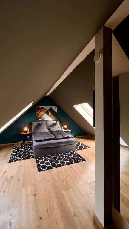 a bedroom with a bed in the attic at H-85 SUITES LEVEL 5/10 in Koblenz