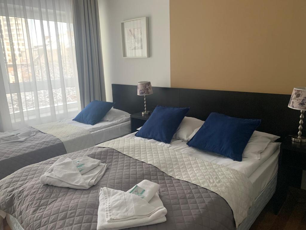 Postel nebo postele na pokoji v ubytování Hotel Blick