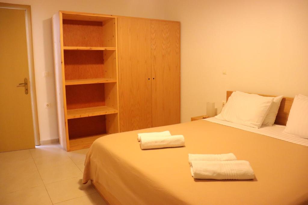 Uma cama ou camas num quarto em Apartments Piazza