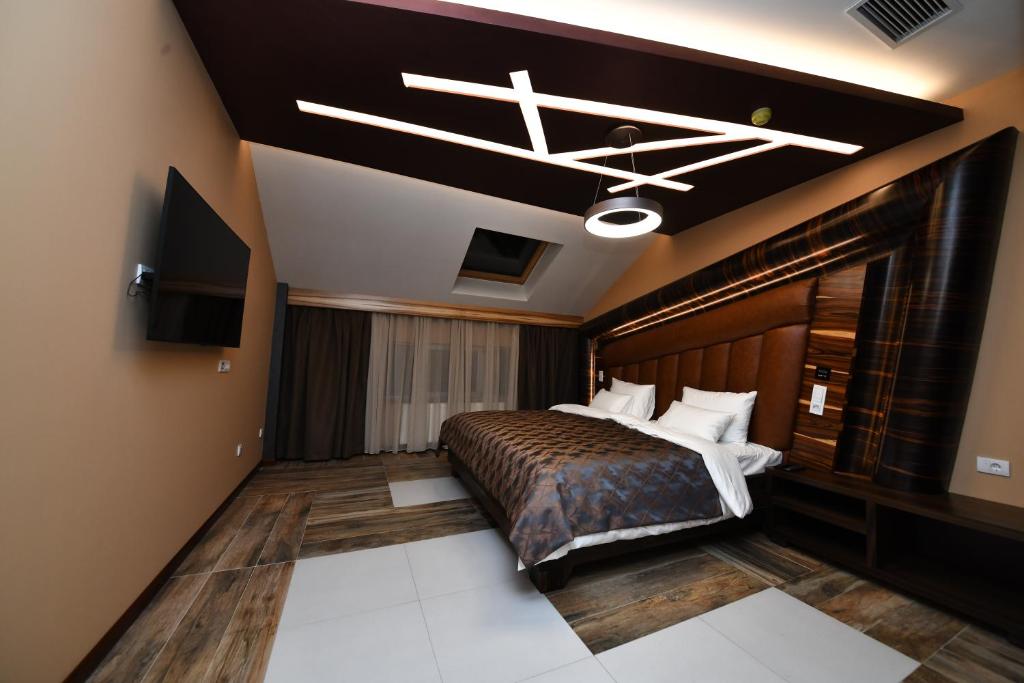 Postel nebo postele na pokoji v ubytování Hotel Havana Loznica