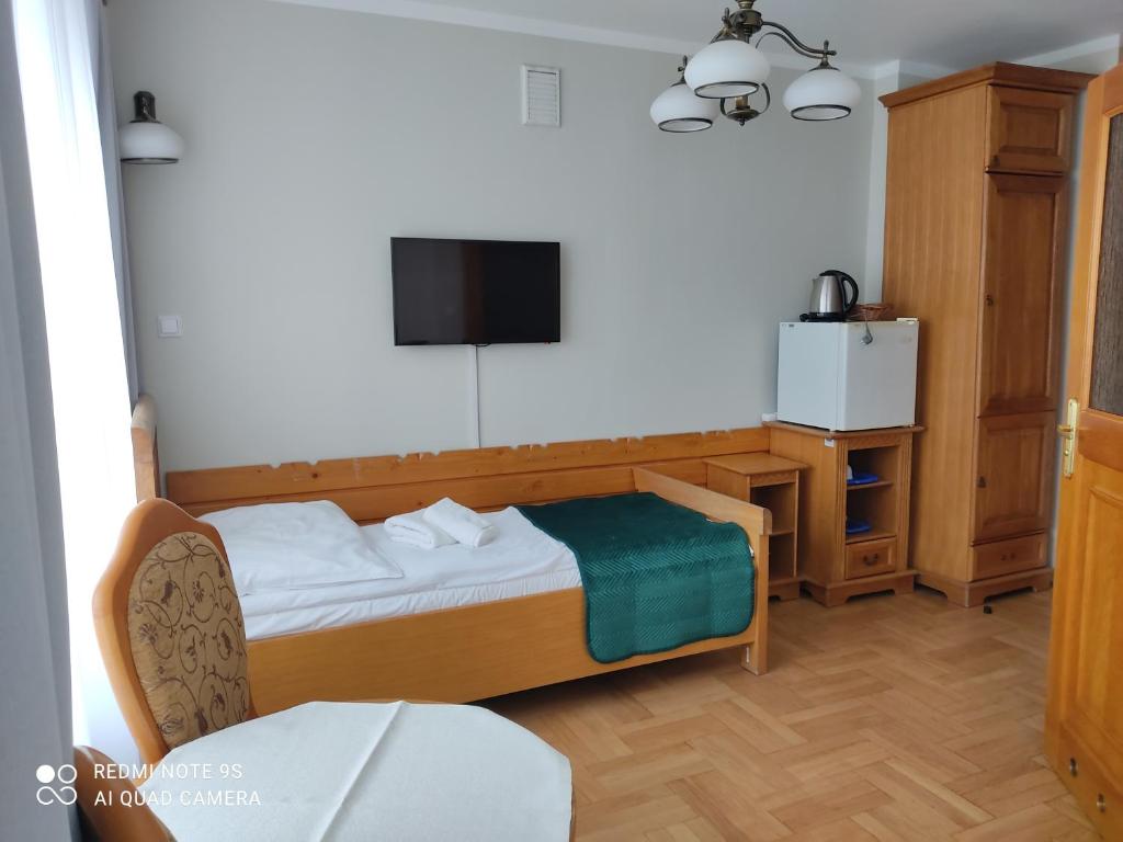 Posteľ alebo postele v izbe v ubytovaní Pokoje Gościnne Zakopane