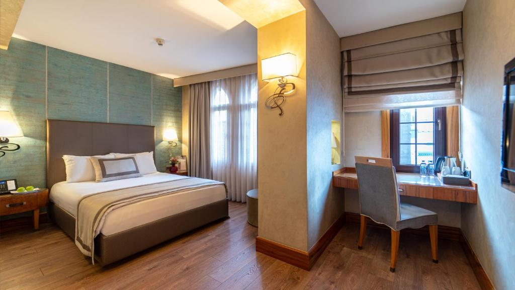 Postel nebo postele na pokoji v ubytování Biz Cevahir Hotel Sultanahmet