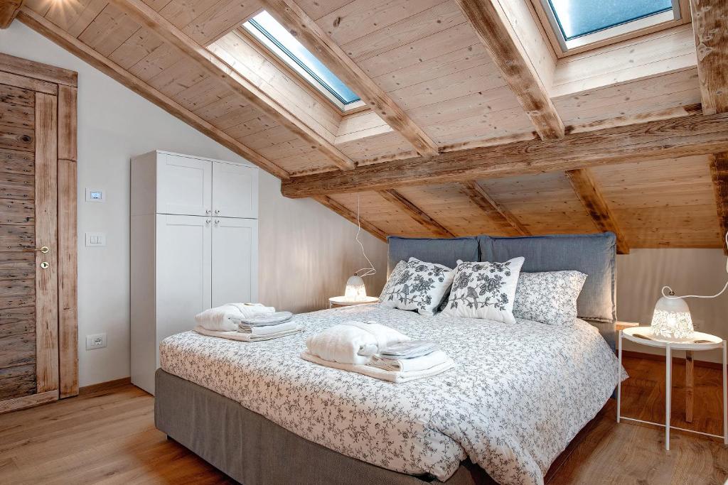 Łóżko lub łóżka w pokoju w obiekcie Wellness Lodge Chicca