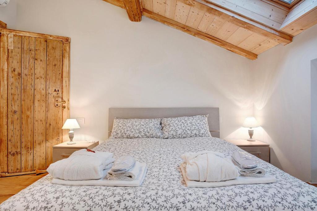 Łóżko lub łóżka w pokoju w obiekcie Wellness Lodge Chicca