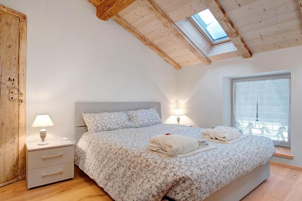 Łóżko lub łóżka w pokoju w obiekcie Wellness Lodge Chicca