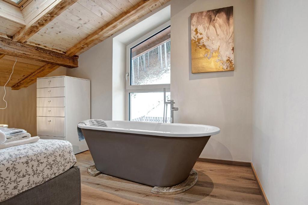 Łóżko lub łóżka w pokoju w obiekcie Wellness Lodge Chicca