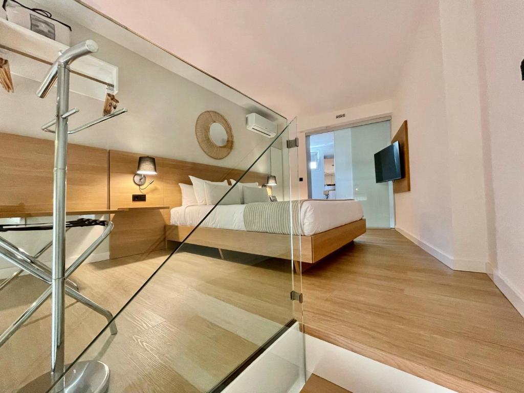 Postel nebo postele na pokoji v ubytování Hotel Emblemático Hi Suites