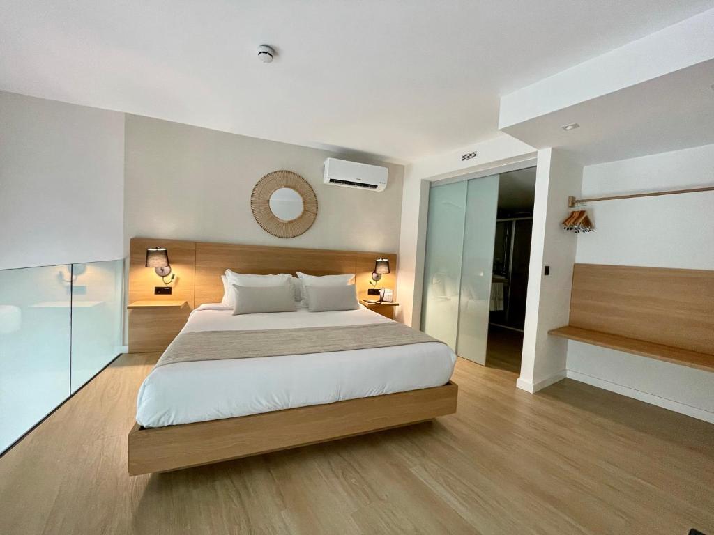 Postel nebo postele na pokoji v ubytování Hotel Emblemático Hi Suites