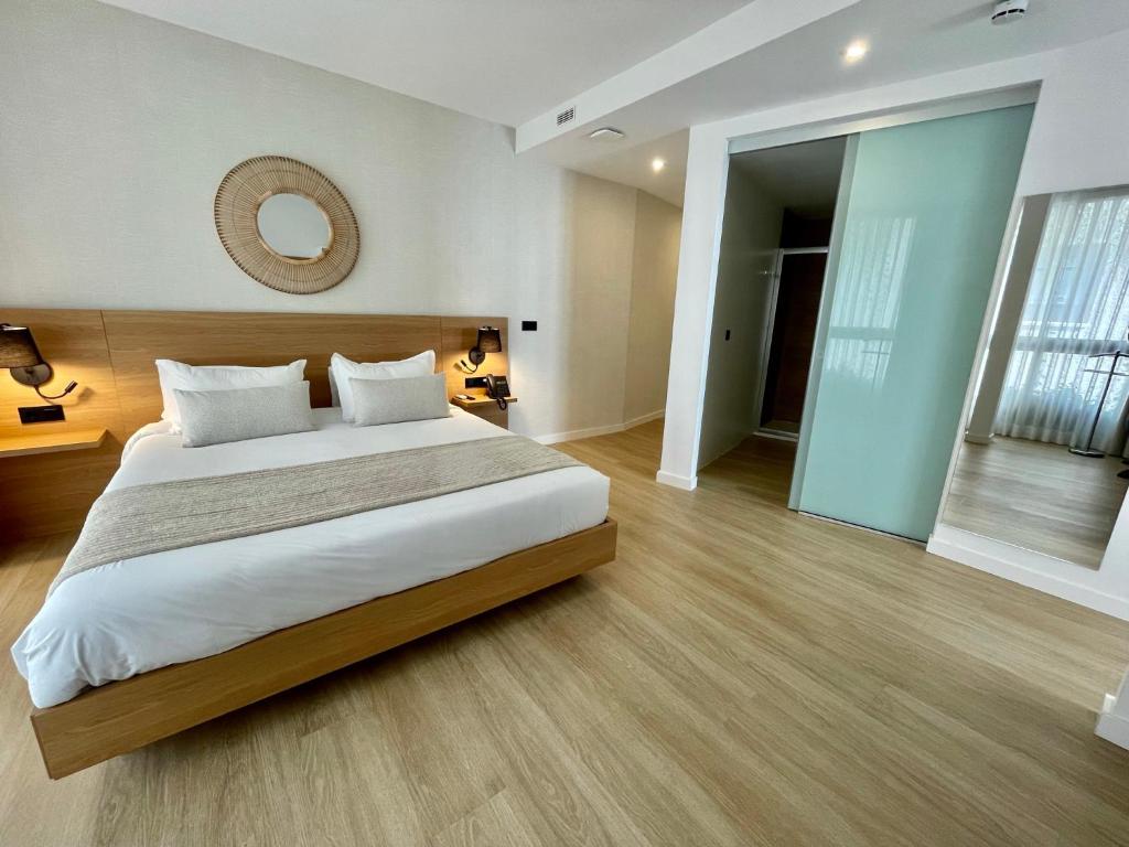 Postel nebo postele na pokoji v ubytování Hotel Emblemático Hi Suites