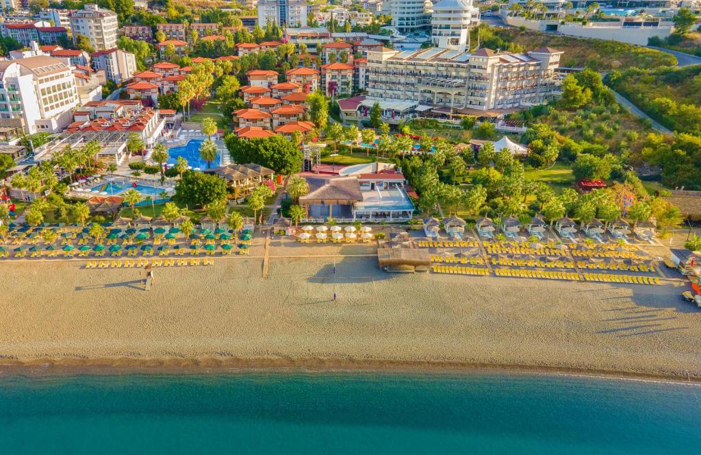 an aerial view of a beach with a resort at Justiniano Club Alanya in Okurcalar