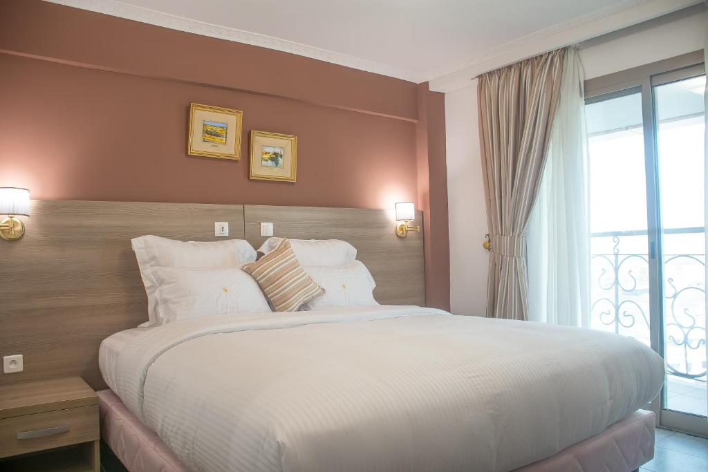 Postel nebo postele na pokoji v ubytování FAYA Hotel