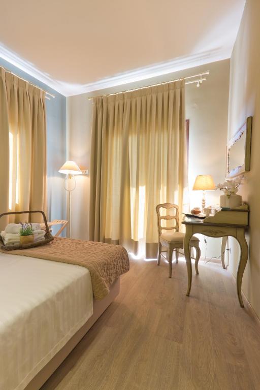 Postel nebo postele na pokoji v ubytování Hotel Galini